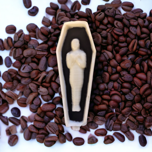 Espresso flavored candy bar in shape of mummy in tomb